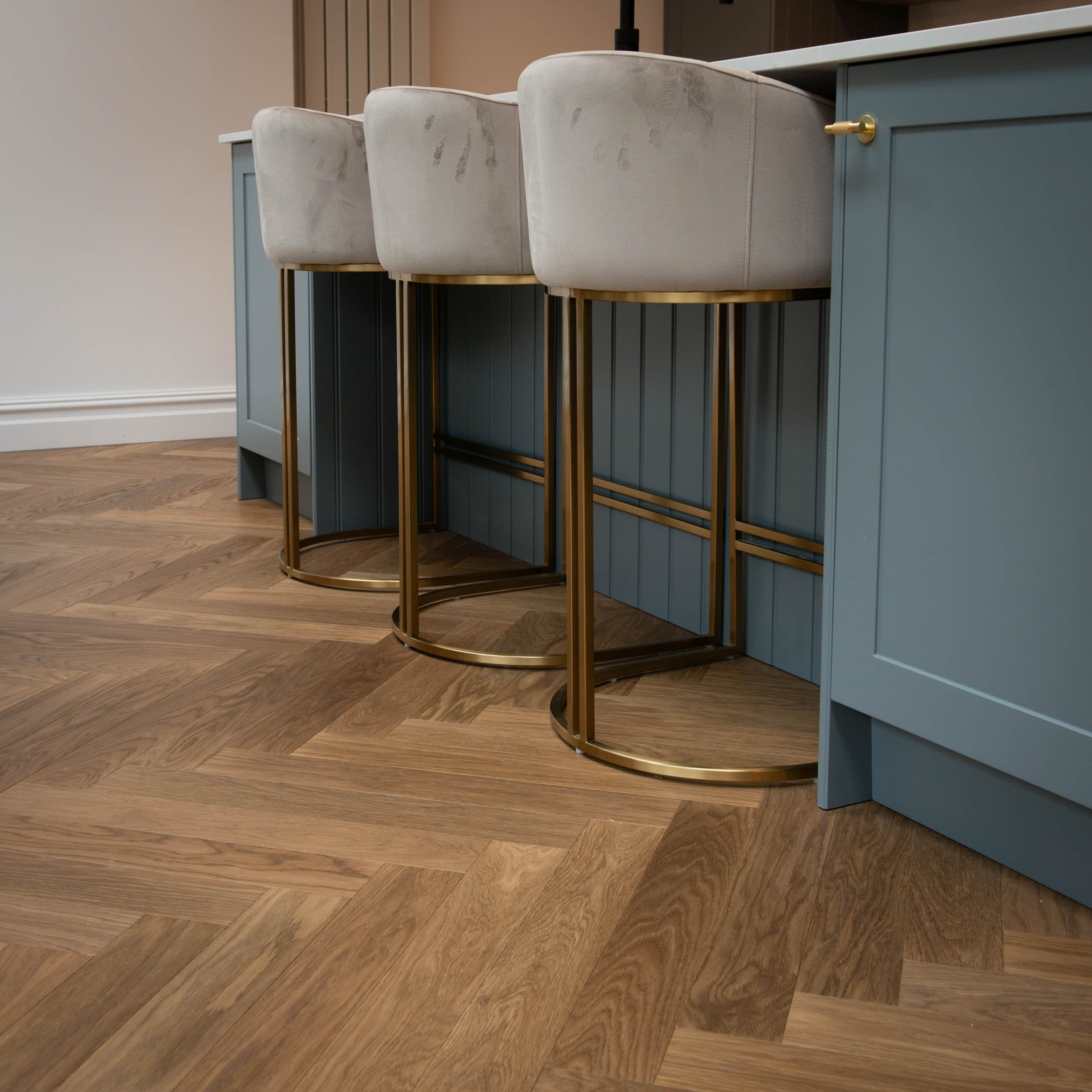 Ritz Oak Herringbone in Kitchen with brass stools