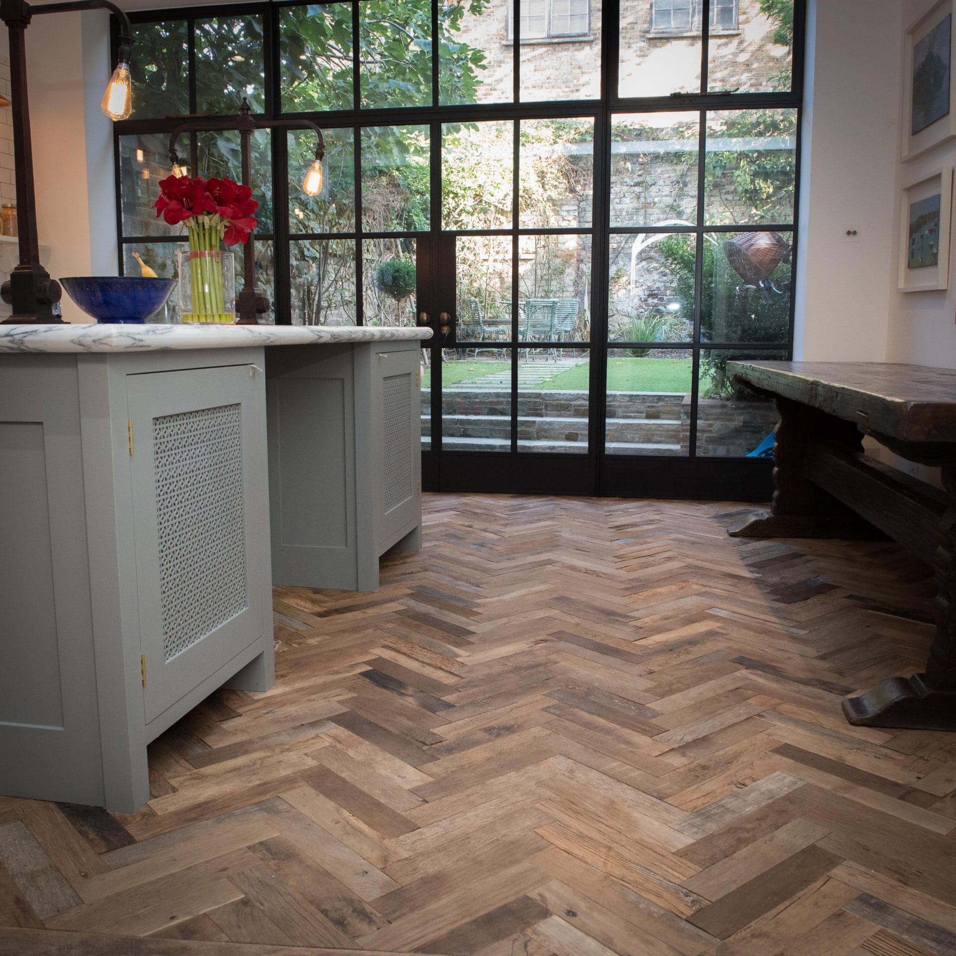 Reclaimed Oak Herringbone Parquet Wood Flooring in kitchen with crittall windows