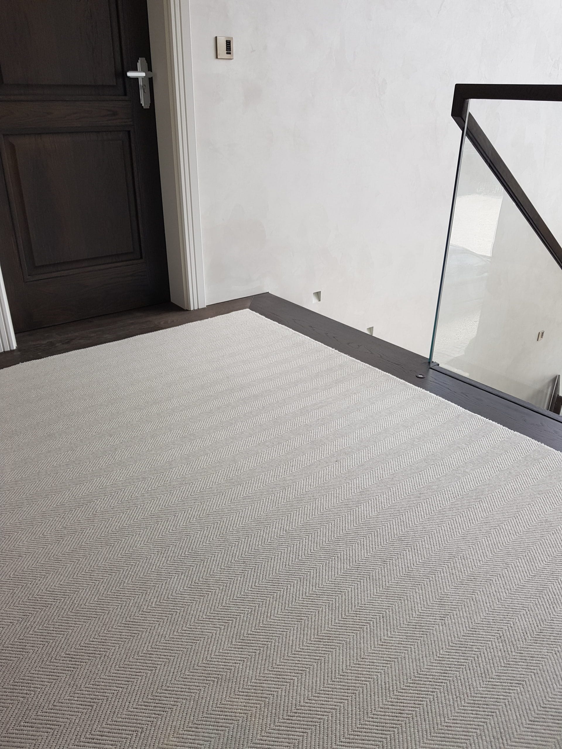 Wool Herringbone Chartwell inlaid carpet with wood floor border