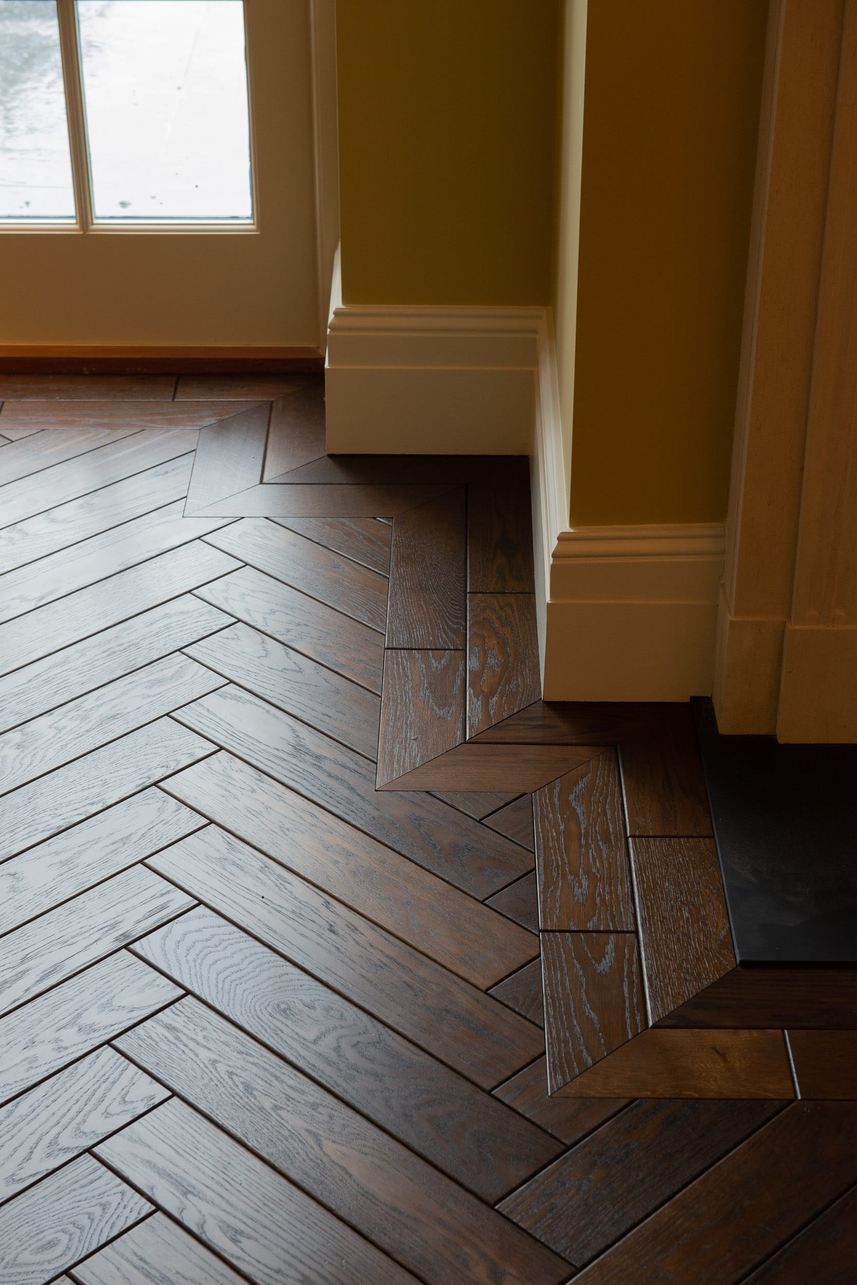 2 line oak border with herringbone flooring