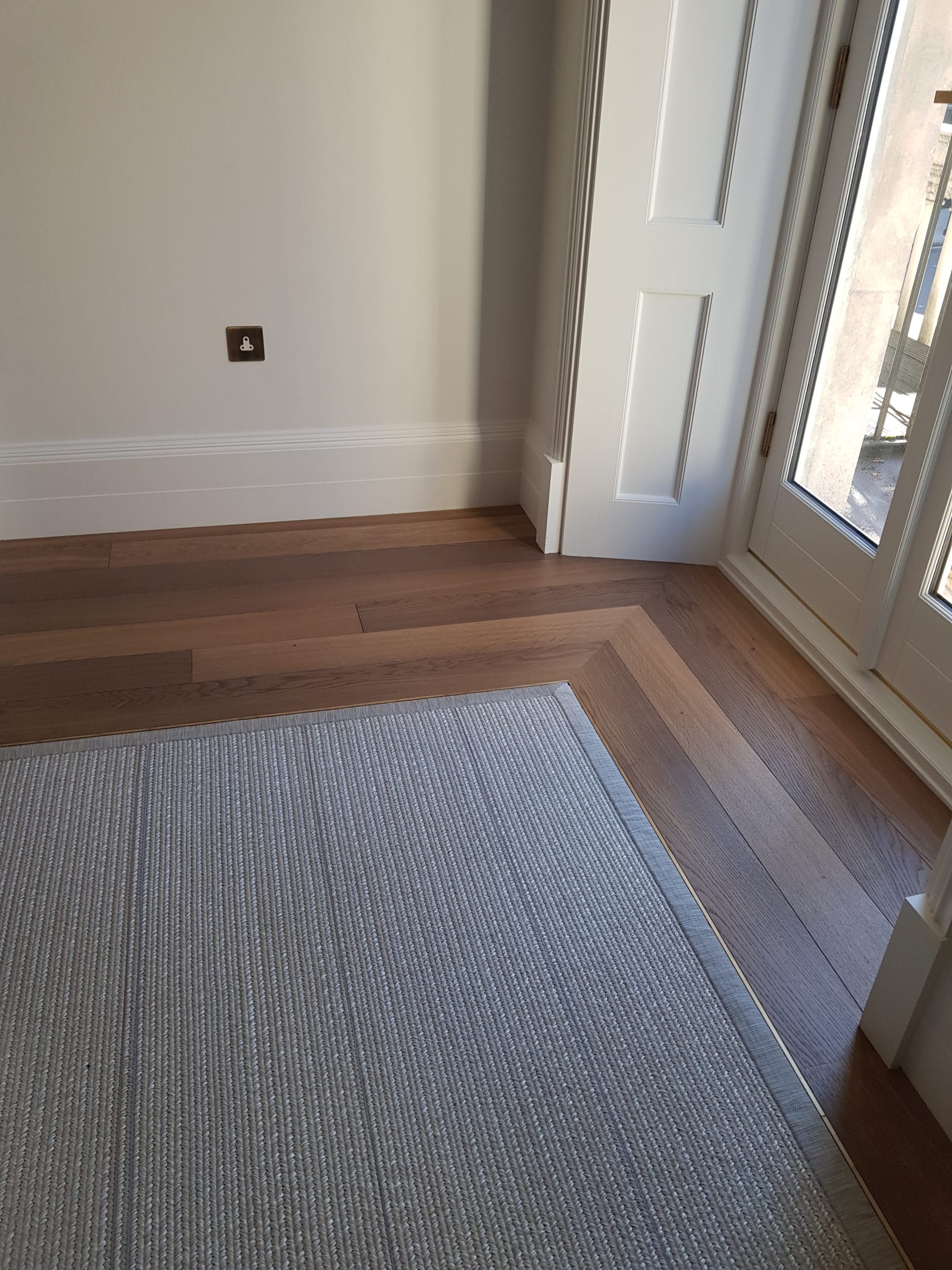 Inlaid Carpet with Brass and Wood Border