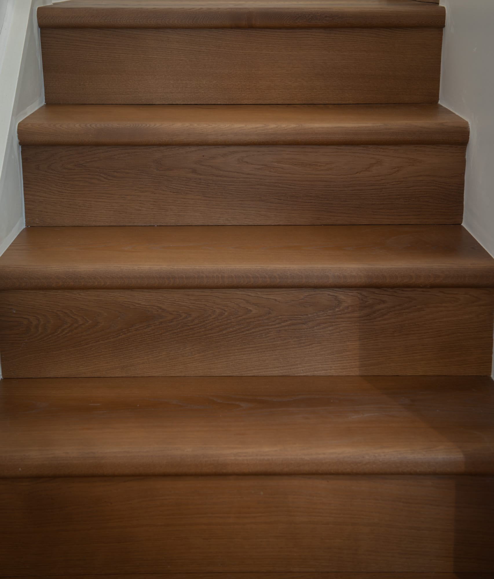Mayfair Oak Stairs clad warm brown oak treads and risers