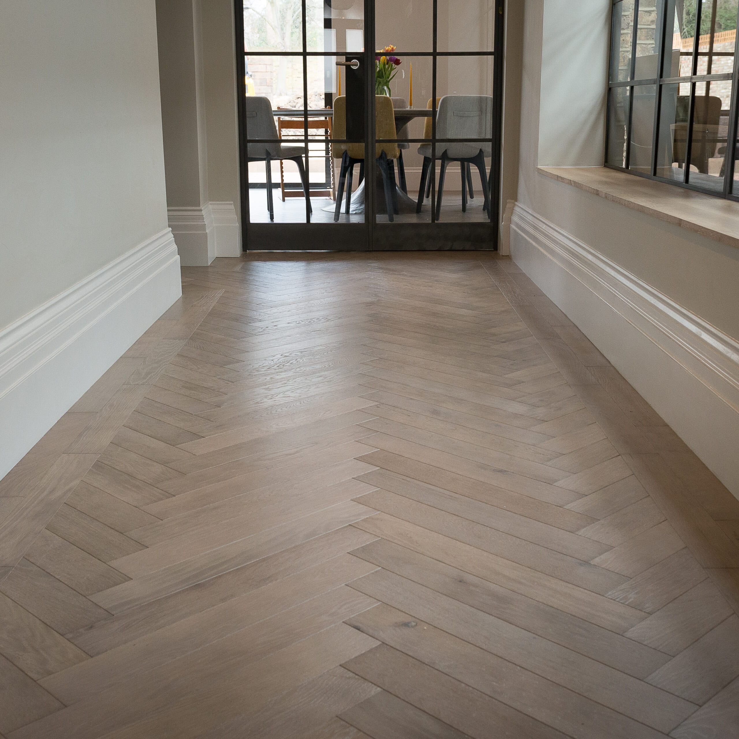 hallway with Oak herringbone and 2 line border - Parquet Flooring in London home