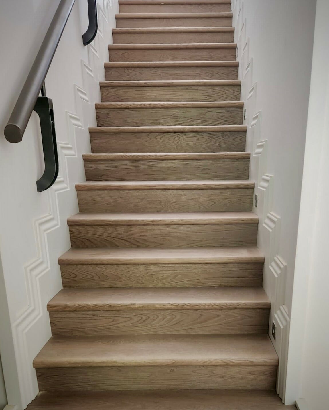 Staircase clad with Oak as complete tread and riser