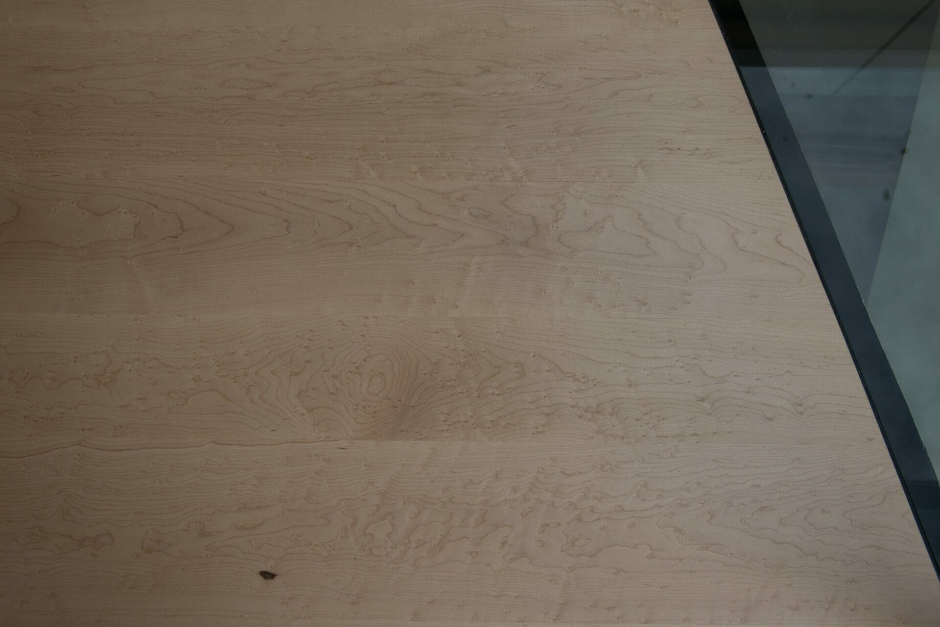 Birds Eye Maple flooring next to glass wall