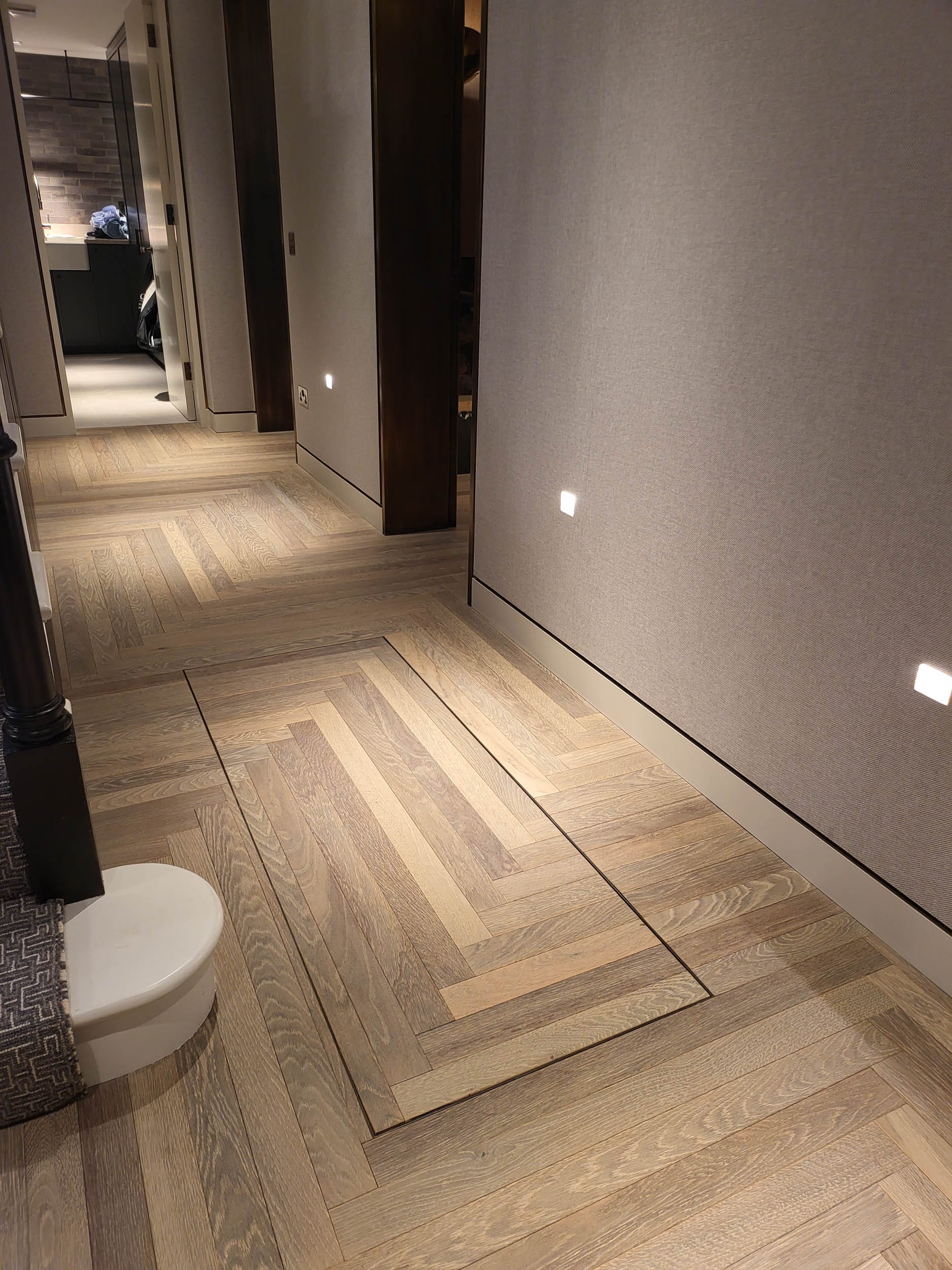 narrow strip herringbone in hallway