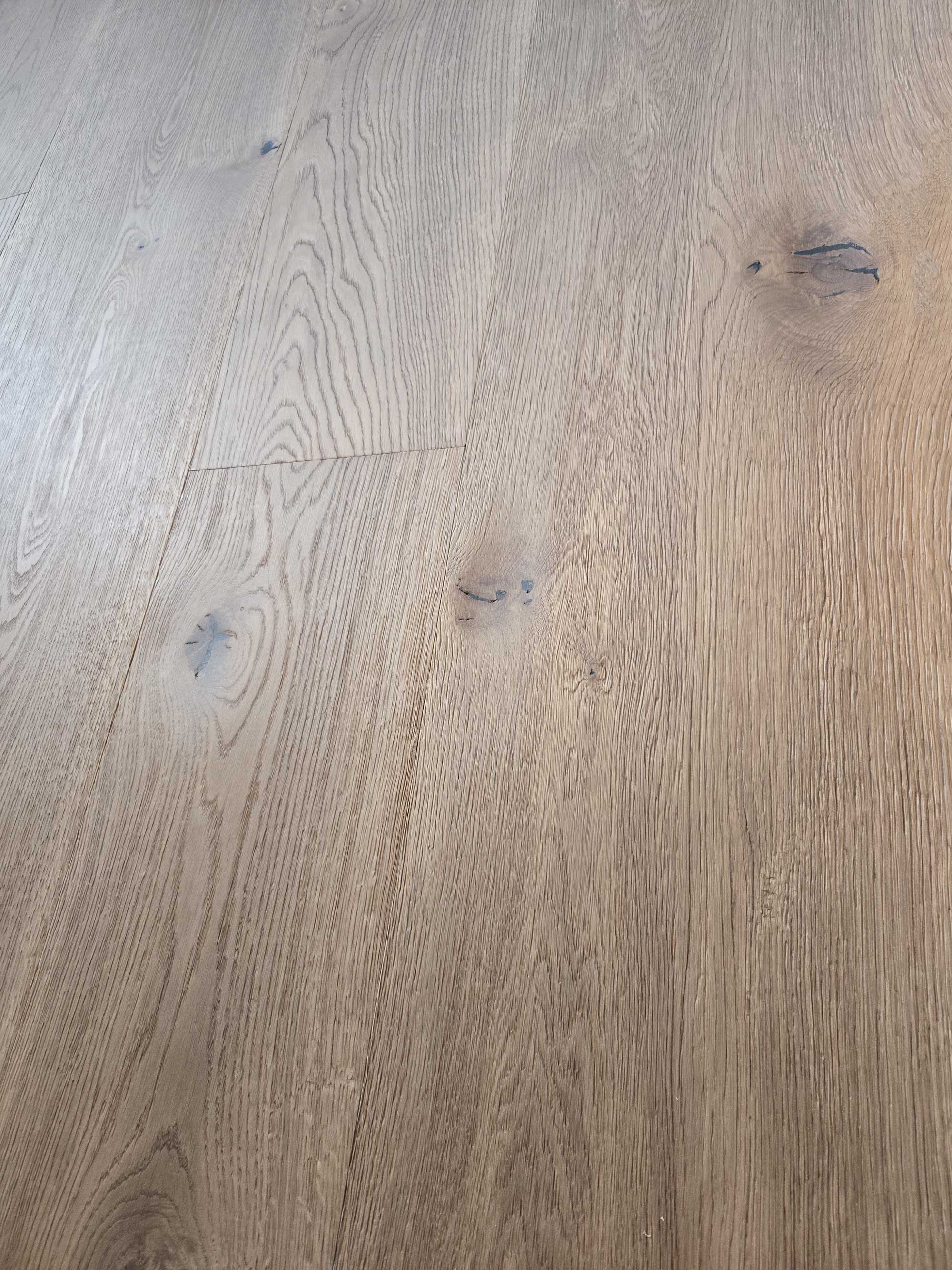 aged oak flooring with light brown tones